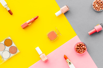 Set of decorative makeup cosmetics on colorful background, top view