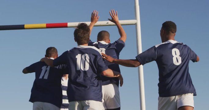 Rugby players celebrating on the field