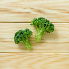 Fresh broccoli cabbage on a light wooden background, top view
