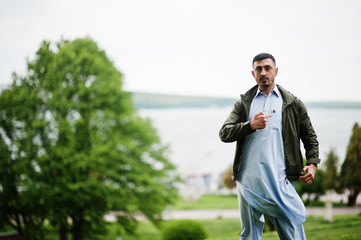 Traditional clothes indian pakistan male portrait.