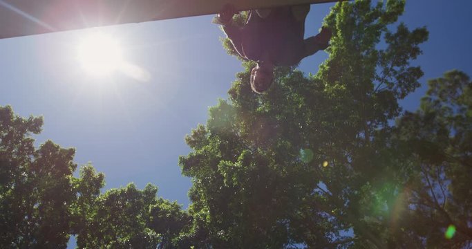 Caucasian man practicing parkour