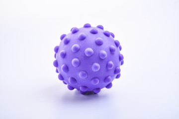 purple colorful bright isolated spiky ball toy, macro