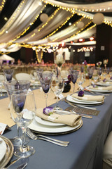 Events table layout with a purple flower on the plates.