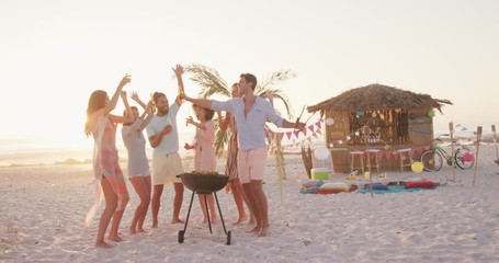 Friends enjoying a bbq on the beach  - Powered by Adobe