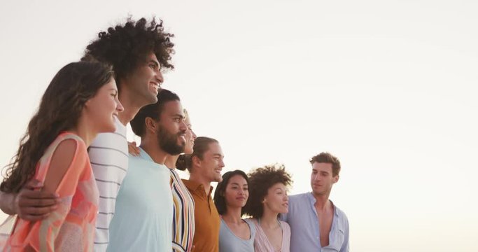 Friends side by side on the beach 