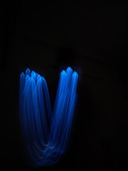 light painting Photography, long exposure, ripple curve and circle against black background