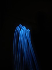 light painting Photography, long exposure, ripple curve and circle against black background