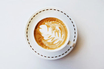 Fresh delicious cappuccino coffee on white background.