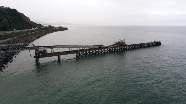 Raynes Jetty North Wales Ocean seascape freight shipping loading platform aerial orbit right