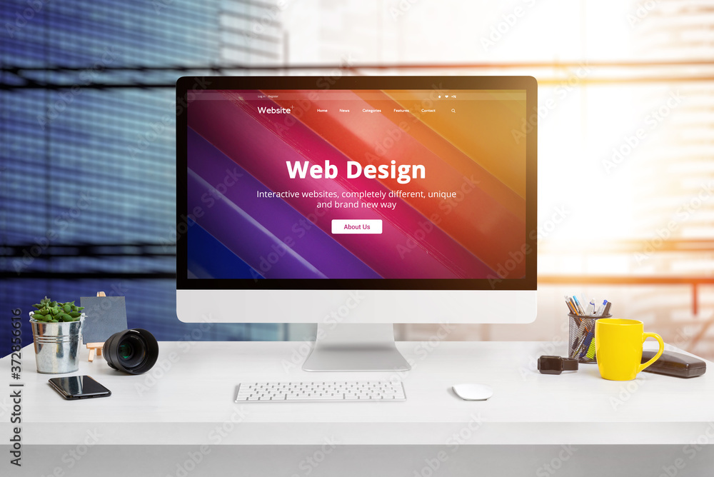 Poster Modern web design studio office with modern flat design website on computer display concept