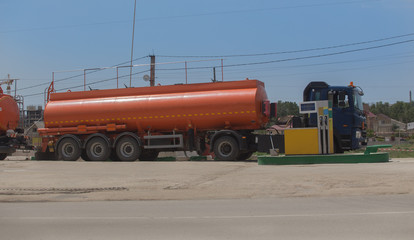 Fuel trucks unload fuel