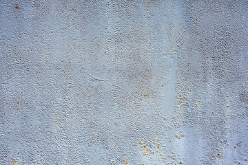 Texture of a metal wall with cracks and scratches which can be used as a background