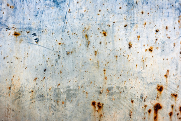 Texture of a metal wall with cracks and scratches which can be used as a background