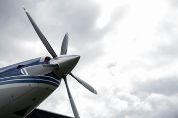 Naklejka na ściany i meble Airplane propeller against the sky.