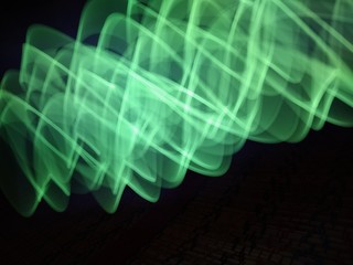 light painting Photography, long exposure, ripple curve and circle against black background