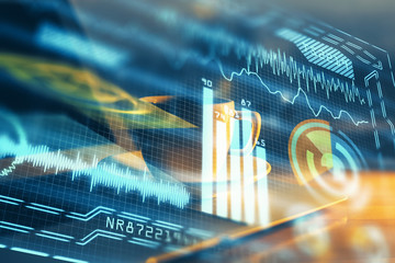 Computer on desktop in office with technology theme hologram. Double exposure. Tech concept.