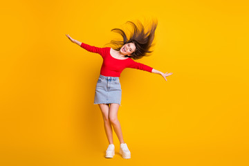 Fototapeta na wymiar Full length body size view of her she nice attractive lovely cheerful cheery carefree thin slender girl dancing having fun enjoy good mood isolated bright vivid shine vibrant yellow color background
