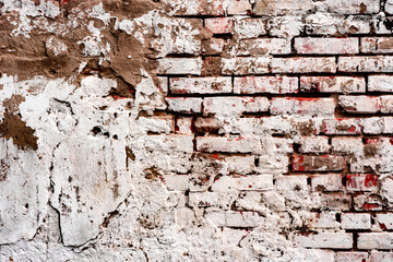Weathered texture of stained old dark white and orange brick wall background