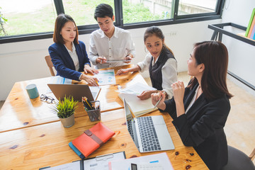 Wide angle of young asian entrepreneurs working together, startup new business