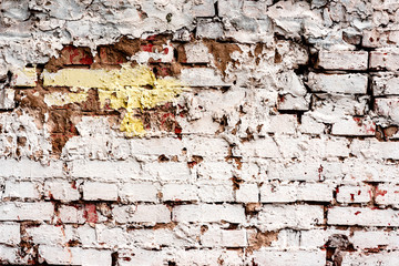 Weathered texture of stained old dark white and orange brick wall background