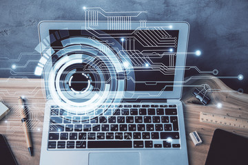 Double exposure of desktop computer and technology theme hologram. Concept of software development.