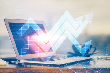 Computer on desktop with point up arrows hologram. Double exposure. Concept of success.