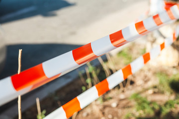 Red and white striped barrier tape