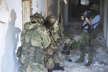 Fototapeta premium A team of professional airsoft players clear the location from opponents