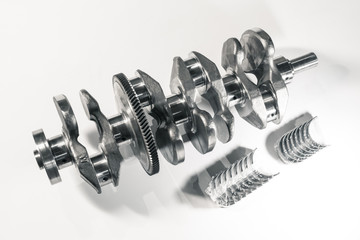 crankshaft and new kit of main bearing set on the white background