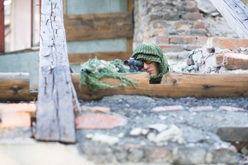 A sniper with an SVD sits on the roof. Safety and security. Airsoft game