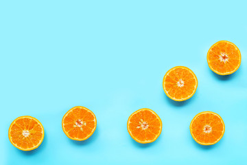 Orange fruit on blue background.
