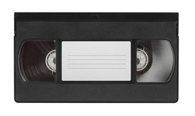 Naklejka premium old video cassette tape with blank label top view isolated on white
