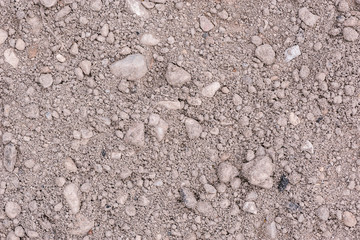 Sand and small stones on the ground.