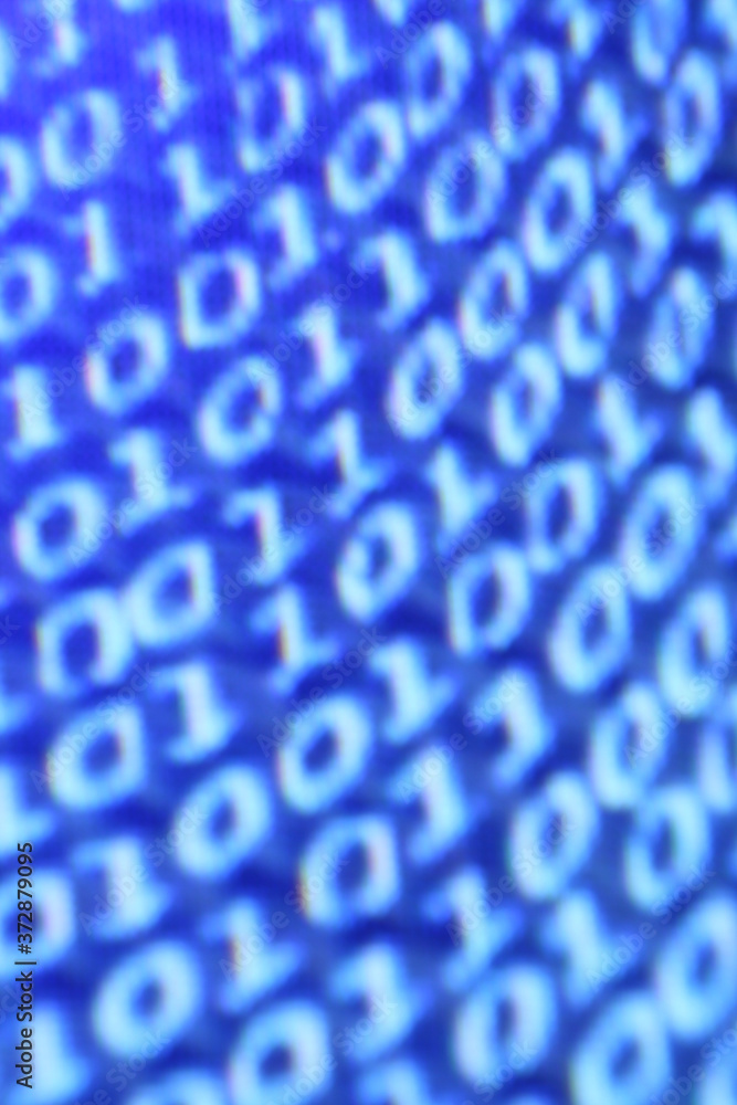Poster vertical closeup shot of a blue blurred screen displaying binary codes - a digital concept