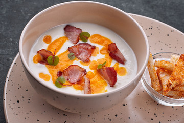Cream soup, cauliflower with bacon, croutons