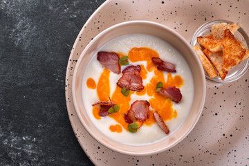 Cream soup, cauliflower with bacon, croutons