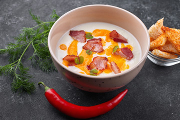 Cream soup, cauliflower with bacon, with croutons. dill, cherry tomatoes, garlic and red hot pepper