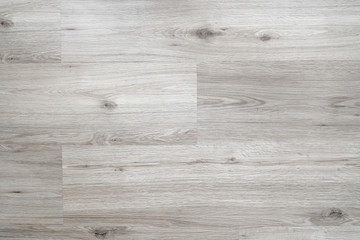 Wood laminate flooring texture background. Light grey wooden textured interior floor.
