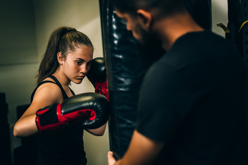 woman kick boxing or boxing training