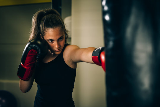 woman kick boxing or boxing training