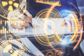 Tech theme hologram over woman's hands taking notes background. Concept of hightech. Double exposure