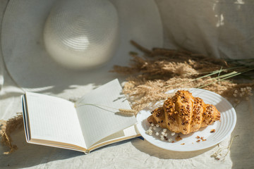 Kitchen interior ideas. Eco friendly kitchen, zero waste home concept.  Eco-friendly breakfast with copybook for plains and ideas. Kniting decor. The concept of saving the planet. Sunny breakfast