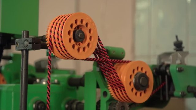 Machine making black and red rope. High quality FullHD footage