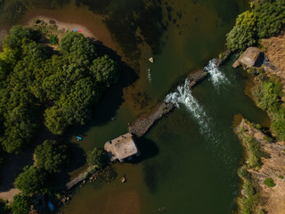 Aerial view from a river with an old water mill. Guadiana River in Portugal	