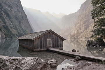 Obersee lake and wooden boathouse in Schoenau am Koenigssee, Germany