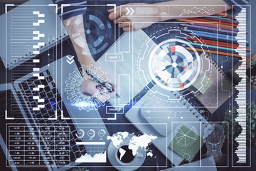 Double exposure of hands making notes with digital coding icons. Computer learning concept.