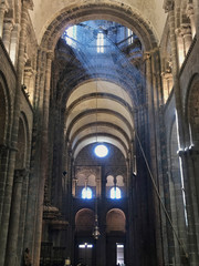 Mystic view inside the Cathedral of Santiago in Galicia, Spain. Beam of light coming through a stained glass