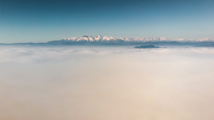 Fototapeta premium Podhale and Tatra Mountains from drone. Photos was taken in spring. Poland, Malopolskie Aerial footage