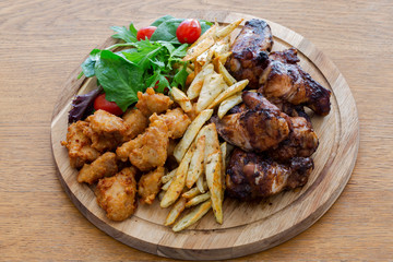 Honey Soy Chicken Wing Nibbles, Fried Chicken with Salad and Potato Chips