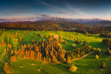 Naklejka premium Podhale and Tatra Mountains from drone. Photos was taken in spring. Poland, Malopolskie Aerial footage